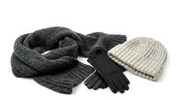 Cozy winter accessories set with knitted scarf, beanie hat and warm gloves isolated on white background for seasonal fashion and cold weather protection.