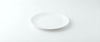 Empty white ceramic plate on clean white background isolated for kitchen dining restaurant menu design mockup presentations.