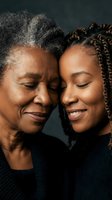 African American mother and adult daughter sharing intimate moment with closed eyes and gentle smiles, showcasing intergenerational bond and family love.