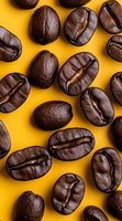 Macro shot of roasted coffee beans scattered on vibrant yellow background showing detailed texture and natural groove patterns. Perfect for cafe marketing.