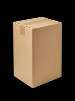 Closed kraft cardboard shipping box isolated on transparent background, ready for packaging design, e-commerce mockups, logistics graphics, and print-on-demand applications.