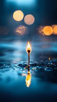 Burning match standing in water with reflection against dark blue background and bokeh lights, creating magical atmospheric mood for spiritual concepts.