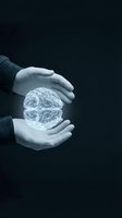 Hands holding glowing brain hologram against dark background, representing artificial intelligence, innovation, and technology concepts for business and science applications.