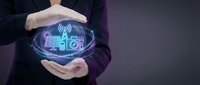 Professional businessman protecting smart home technology with holographic IoT devices and wireless connectivity symbols in hands.