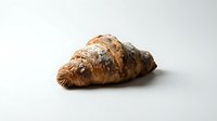 Freshly baked croissant with golden, flaky layers and dusted flour on white background, isolated for bakery, food, and culinary design use.