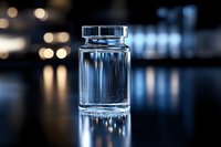 Clear glass medical vial with liquid on dark reflective surface against blurred bokeh background, dramatic lighting creates elegant pharmaceutical atmosphere.