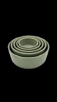 Set of nested ceramic bowls in sage green glaze, isolated on transparent background. Ready for kitchenware catalogs, print on demand, stickers, and T-shirt design use.