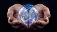 Hands holding glowing crystal ball with blue and purple energy swirls, isolated on black background for fortune telling, spirituality, magic, and mystical concepts.