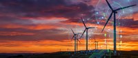 Wind turbines generating renewable energy at sunset with digital technology overlay and data visualization graphics for sustainable power solutions.