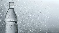 Water drops on glass with plastic bottle silhouette behind creating atmospheric moody composition. Condensation and rain droplets capture natural light effect.