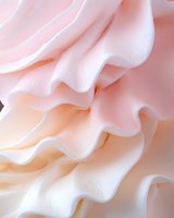 Delicate pink rose petals with soft ruffled edges creating elegant flowing layers. Romantic floral texture for wedding invitations and feminine designs.