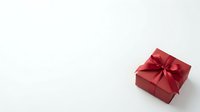 Red gift box with ribbon bow on white background, suitable for holiday, celebration, and festive marketing materials.