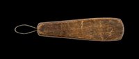 Vintage wooden shoehorn with metal loop handle, isolated on transparent background. Rustic antique tool for clipart, stickers, print on demand, sublimation, and t-shirt design use.
