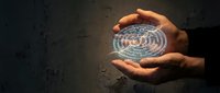 Hands holding a glowing holographic maze sphere in darkness, symbolizing problem-solving, strategy, and complex thinking in business.