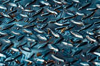 Metallic blue industrial diamond plate surface with raised geometric pattern creating dynamic light reflections and shadows. Durable steel background texture.