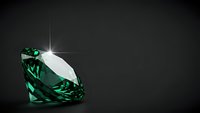 Sparkling emerald green diamond gemstone with brilliant cut facets reflecting light on dark background for luxury jewelry and precious stone concepts.