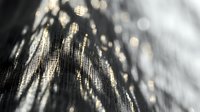 Luxurious golden sequined fabric with shimmering metallic texture and bokeh light effects for fashion and glamour projects.