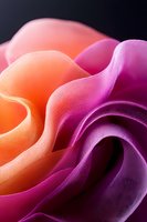 Abstract macro photography of curved waves in vibrant orange and purple gradient colors creating soft flowing shapes against dark background.