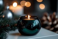 Elegant teal candle holder with warm flame creates cozy holiday atmosphere with pine branches and bokeh lights for festive home decor and relaxation.