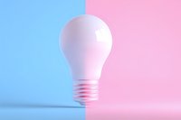 White light bulb on dual-colored blue and pink background, symbolizing creative ideas and gender concepts for business presentations.