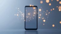 Smartphone screen emitting magical glowing particles and bokeh lights against blue background, creating ethereal atmosphere for technology and innovation concepts.