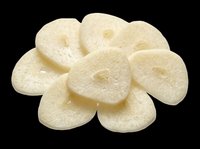 Sliced garlic cloves pile isolated on transparent background, ready for food design, stickers, print on demand, clipart, and culinary T-shirt projects.