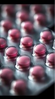 Pink pharmaceutical pills in blister pack macro shot with selective focus, showing medical treatment and healthcare concept in modern medicine.