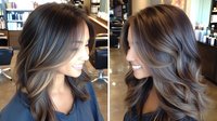 Trendy ash brown balayage hair color with soft waves and highlights on long layered cut, showcasing modern salon styling technique for brunette base.