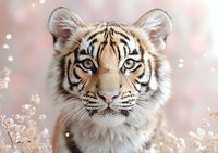 Young white tiger close-up portrait with blue eyes against pink bokeh background with glitter and sparkles, showing majestic feline expression and detailed fur texture.