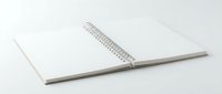 Open blank spiral notebook with white pages on clean background for office supplies and stationery design projects.