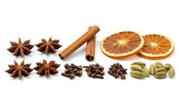 Aromatic spices collection with star anise, cinnamon stick, cloves, cardamom pods and dried orange slices isolated on white background for cooking.