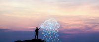 Man standing on mountain silhouette observing glowing digital network cloud with connected icons at sunset, representing technology innovation, data connectivity, and cloud computing solutions.