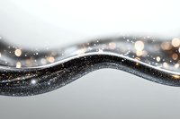Abstract wavy line with black glitter texture and golden bokeh lights on gray background creates elegant flowing design for luxury branding and festive layouts.
