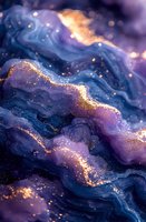 Abstract fluid art background with deep blue and purple waves adorned with golden glitter effect, creating a luxurious cosmic atmosphere for elegant design projects.