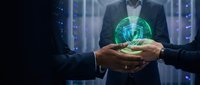 Male professional in dark business suit holding glowing green shield symbol representing cybersecurity, data protection, and network security in modern server room environment.