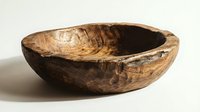 Rustic handcrafted wooden bowl with natural grain texture, isolated on white background. Organic artisan kitchenware for food styling and home decor.
