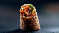 Fresh vegetable spring roll filled with colorful carrots, cucumber and bell peppers on dark background, macro food photography for restaurant menu.