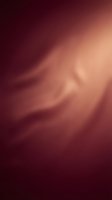 Soft blurred gradient background transitioning from deep burgundy to warm peachy tones, creating an abstract, dreamy atmosphere suitable for overlays and design projects.