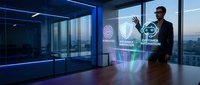 Man in business attire interacting with holographic AI interface displaying innovation and automation icons in modern high-rise office with city skyline view.