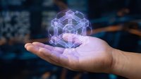 Hand holding glowing purple holographic cube structure with connected nodes and lines representing blockchain technology and digital innovation concepts.