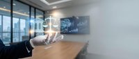 Modern businessman hand presenting holographic data analytics icons in contemporary office boardroom with digital technology interface.