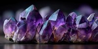 Vibrant purple amethyst crystal cluster with translucent points and facets against dark background, showcasing natural mineral formation for spiritual or decorative use.