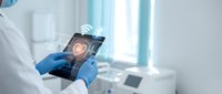 Medical professional using digital tablet with holographic brain interface in modern healthcare facility for neurological diagnosis and treatment planning.