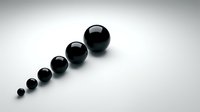 Black spheres in ascending size order on white background creating minimalist geometric composition for modern design projects and presentations.