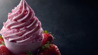 Pink whipped cream swirl with fresh strawberries on dark background, macro food photography for dessert menu, restaurant promotion and culinary design.