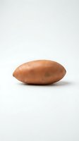 Single russet potato with brown skin and natural texture isolated on white background for food and cooking projects.