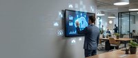 Professional businessman in suit interacting with futuristic digital interface displaying cloud computing icons and data analytics in modern office.