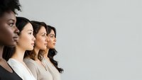 Diverse group of professional women in profile view showing unity and leadership in modern workplace setting for business and career concepts.