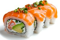 Fresh salmon rolls with avocado, cucumber and crab meat topped with green onions. Close-up view of traditional Japanese sushi on white background.