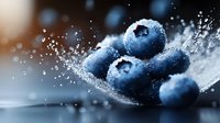 Fresh blueberries with water splash and droplets on dark background, macro photography showing texture and juicy details in dramatic lighting.